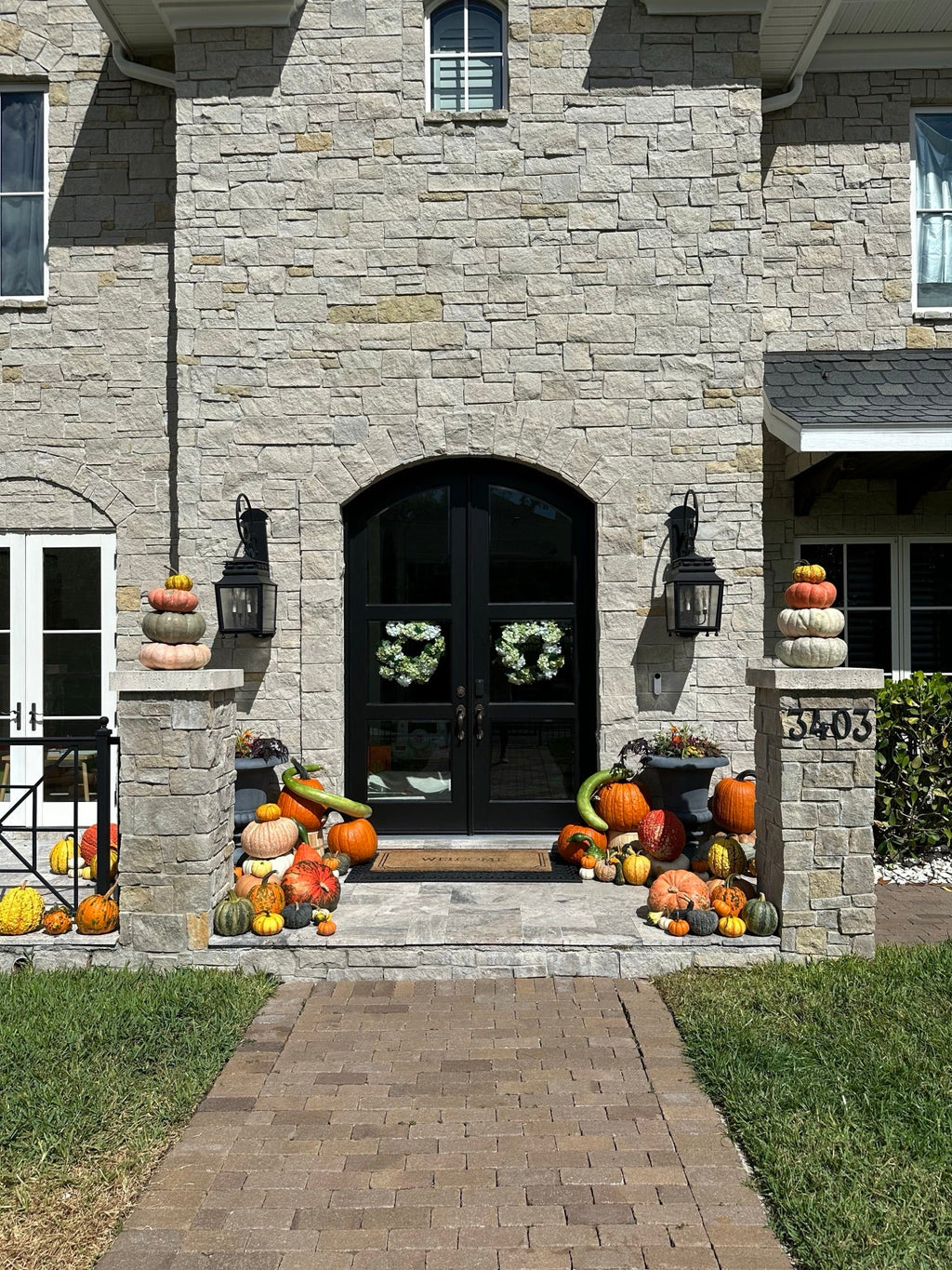The Estate pumpkin porch install photo
